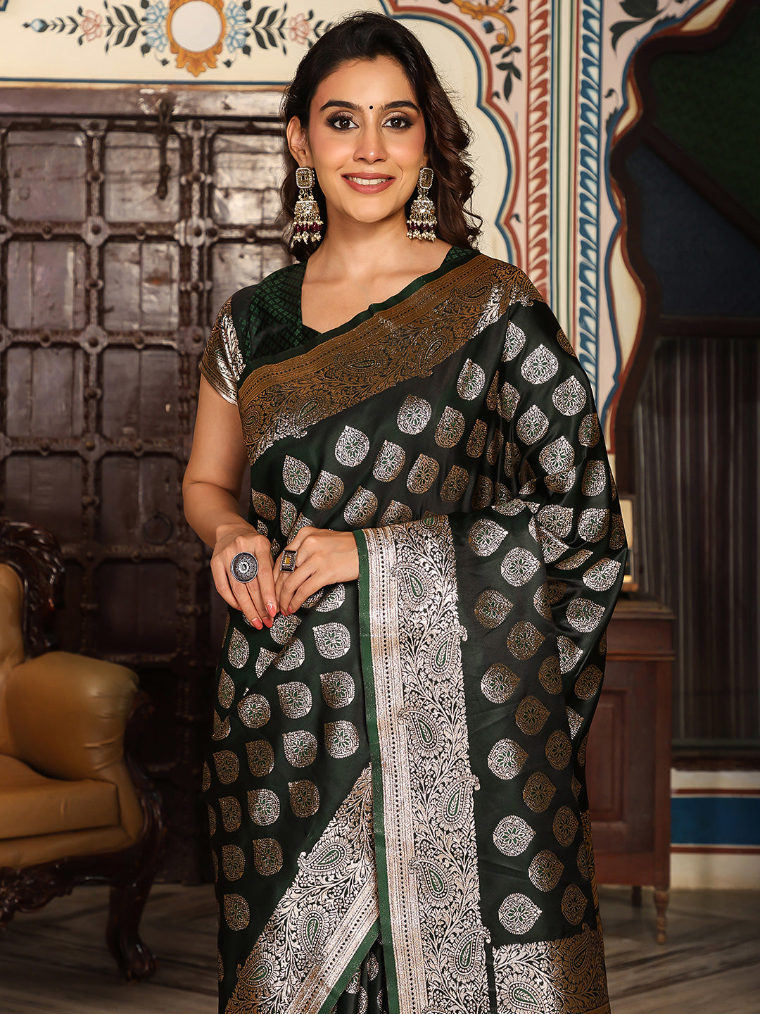 Bottelgreen woven kanjivaram soft silk saree with blouse piece