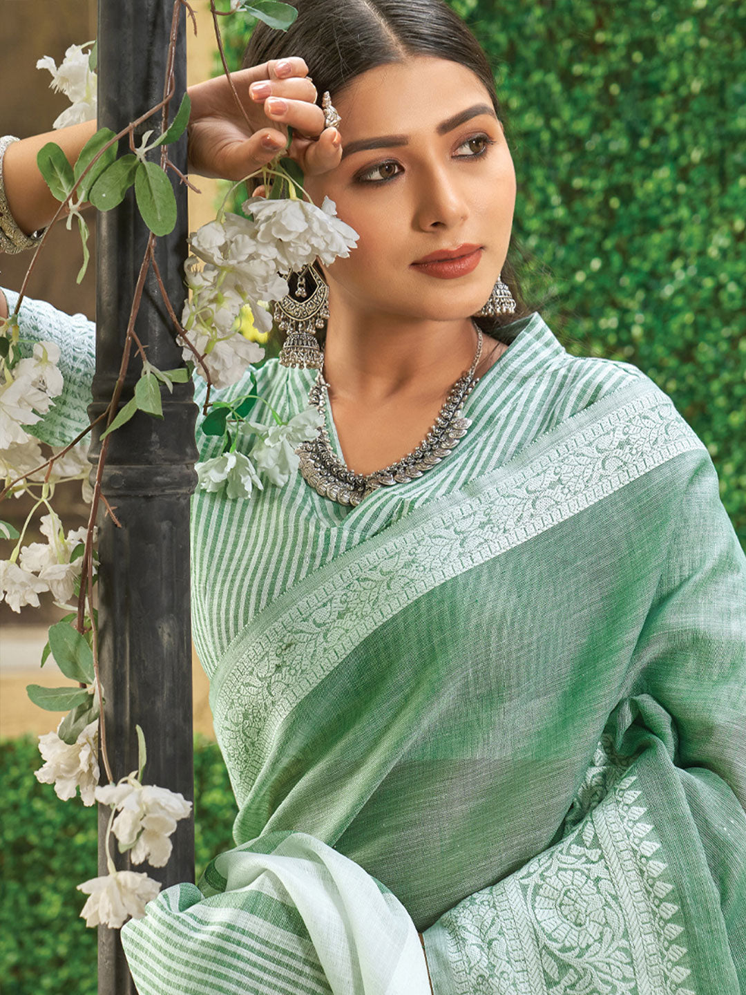 Rama Green woven linen saree with blouse piece